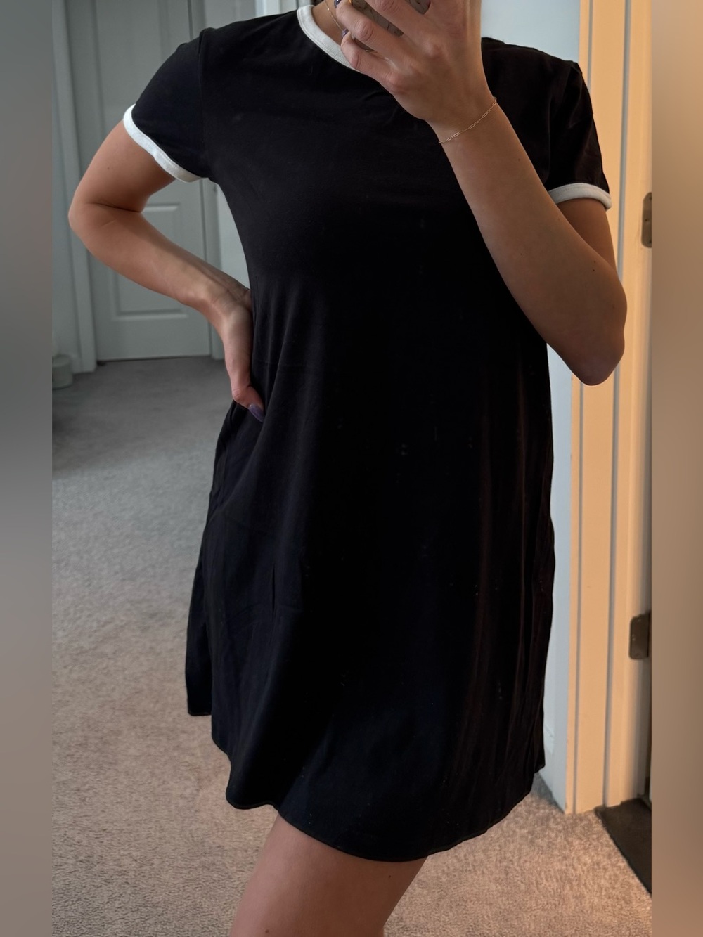 H&M women’s black t-shirt dress with white on sleeves and neck line in size M